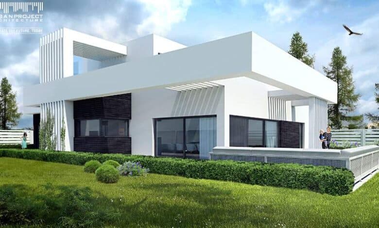 Nowoczesny dom jednorodzinny z dużymi oknami i przestronnym tarasem, zaprojektowany jako przykład innowacyjnej architektury od Panidyrektor.pl, idealny dla miłośników funkcjonalności i estetyki.