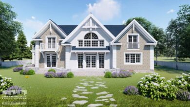 Nowoczesny dom jednorodzinny z dużymi oknami i balkonami, otoczony zielonym ogrodem z kwiatami, idealny dla rodzin szukających komfortowej przestrzeni życiowej w spokojnej okolicy.