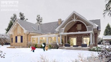 Nowoczesny dom z dużym tarasem i jasnymi elewacjami, otoczony zimowym krajobrazem i drzewami, idealny jako przykład architektury dla optymalnych projektów domu.