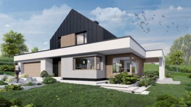 Nowy, nowoczesny dom jednorodzinny z minimalistycznym designem i dużymi oknami na zielonym tle. Idealne rozwiązania dla komfortu i estetyki w harmonii z naturą.