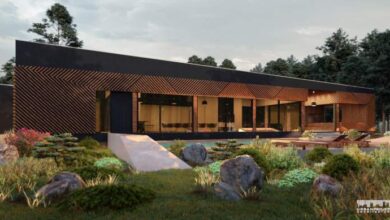 Nowoczesny budynek biurowy z dużymi oknami i drewnianymi elementami architektonicznymi, otoczony zielonym ogrodem, idealny dla firm ceniących ekologiczne rozwiązania i nowoczesny design.