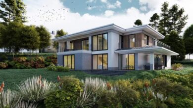 Nowoczesny dom jednorodzinny na zielonej działce z dużymi oknami i tarasem, otoczony naturalną roślinnością, idealny do życia i odpoczynku w zgodzie z naturą.